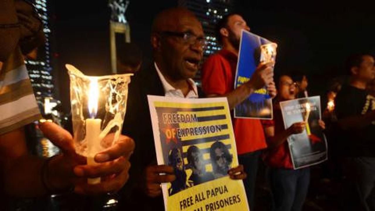 Aksi lilin solidaritas untuk Papua