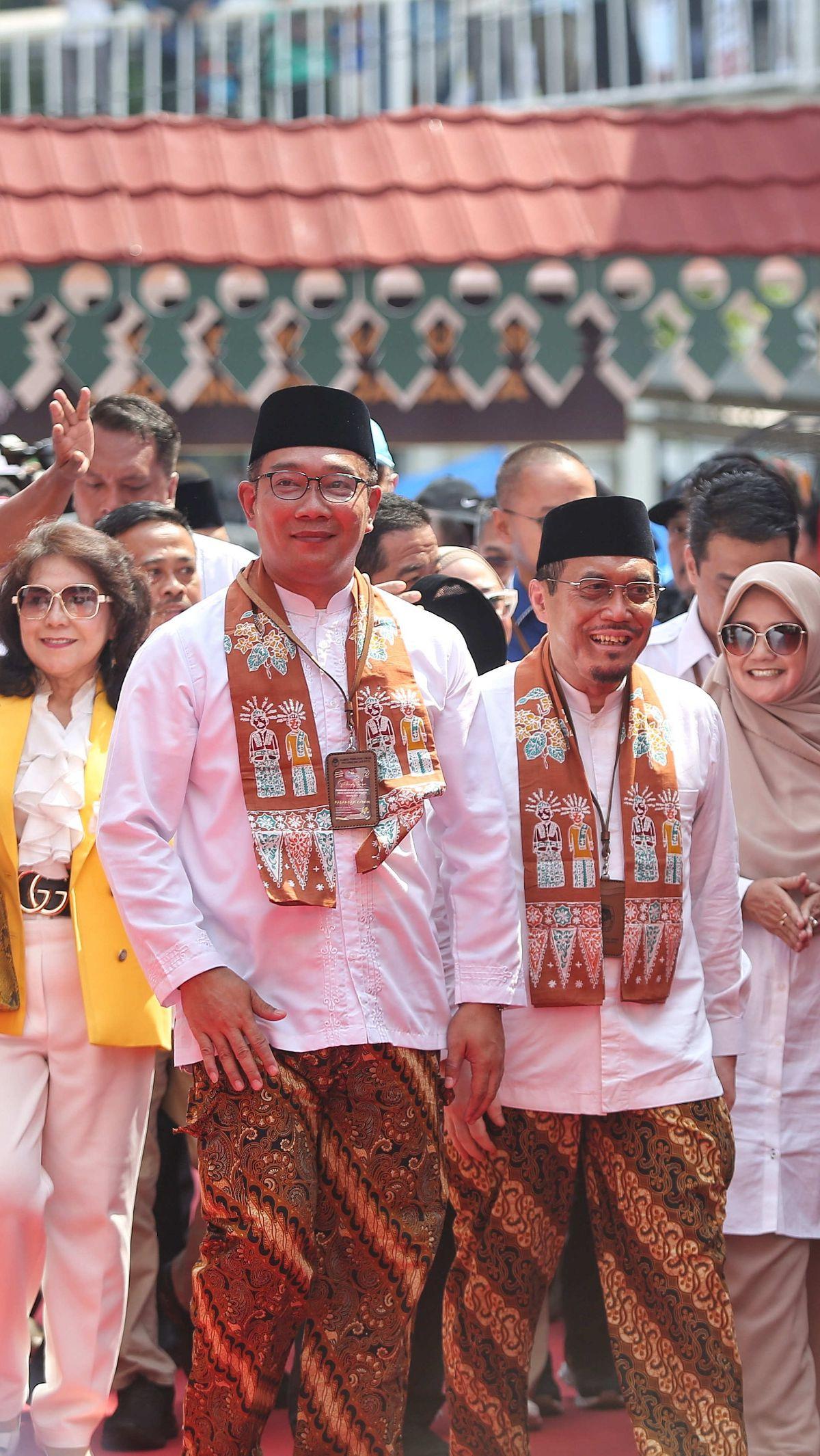 RK-Suswono tiba di Gedung KPU DKI Jakarta dengan wajah semringah.&nbsp;Foto: Liputan6.com/Angga Yuniar