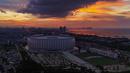 Foto udara kawasan Jakarta International Stadium (JIS) di tengah kepadatan pemukiman Kota Jakarta di Papanggo, Jakarta Utara, Senin (14/4/2025). (merdeka.com/Arie Basuki)