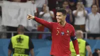 Pemain Portugal Cristiano Ronaldo berselebrasi usai mencetak gol ke gawang Prancis pada laga grup F Euro 2020 di Puskas Arena, Budapest, Kamis, 24 Juni 2021. (Franck Fife, Pool photo via AP)
