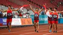 Lalu Muhammad Zohri (dua kanan) bersama Fadlin, Eko Rimbawan, dan Bayu Kertanegara melakukan selebrasi usai meraih perak dalam final lari 4x100 meter cabang olahraga atletik Asian Games 2018 di Jakarta, Kamis (30/8). (AP Photo/Bernat Armangue)