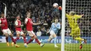 Pemain Manchester City, John Stones, mencetak gol ke gawang Arsenal pada laga Liga Inggris di Stadion Etihad, Kamis (27/4/2023). (AP Photo/Dave Thompson)