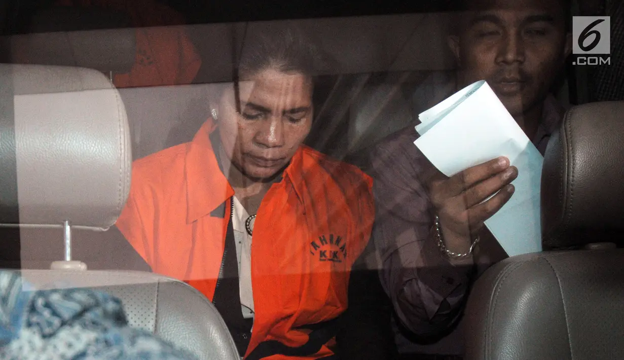 Merry Purba resmi ditetapkan tersangka dan ditahan KPK terkait suap putusan penanganan perkara dipengadilan Tipikor Medan.(merdeka.com/Dwi Narwoko)