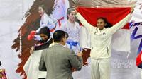 Karateka Papua, Librin Margareth Nenobesi membawa pulang medali emas pada Kejuaraan Internasional Thailand Open di CU Sport Compleks Thailand. (Liputan6.com/Katharina Janur/Jorsul)