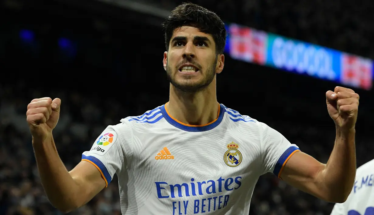 Rekan Benzema, Marco Asensio juga berhasil menorehkan namanya di daftar pencetak hattrick Liga Spanyol pada musim ini. Asensio melakukan hal tersebut saat Real Madrid pesta 6-1 ke gawang Real Mallorca pada pekan keenam. (AFP/Oscar Del Pozo)