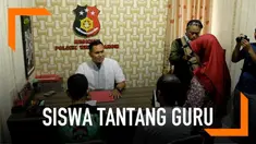 Siswa SMP di Gresik yang sempat menantang gurunya berkelahi menyampaikan pengakuannya di kantor polisi.