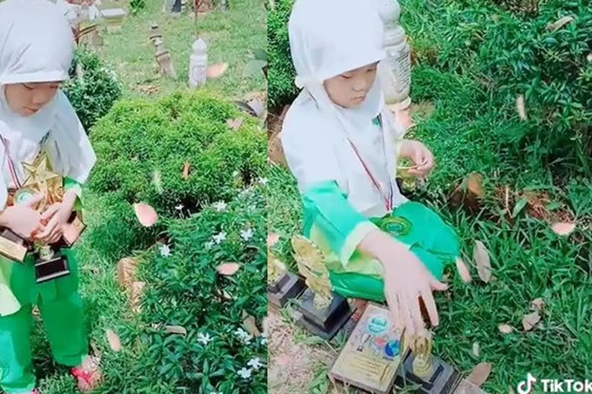 Bocah Bawa Banyak Piala ke Makam Sang Ayah, Kisah di Baliknya Bikin Haru