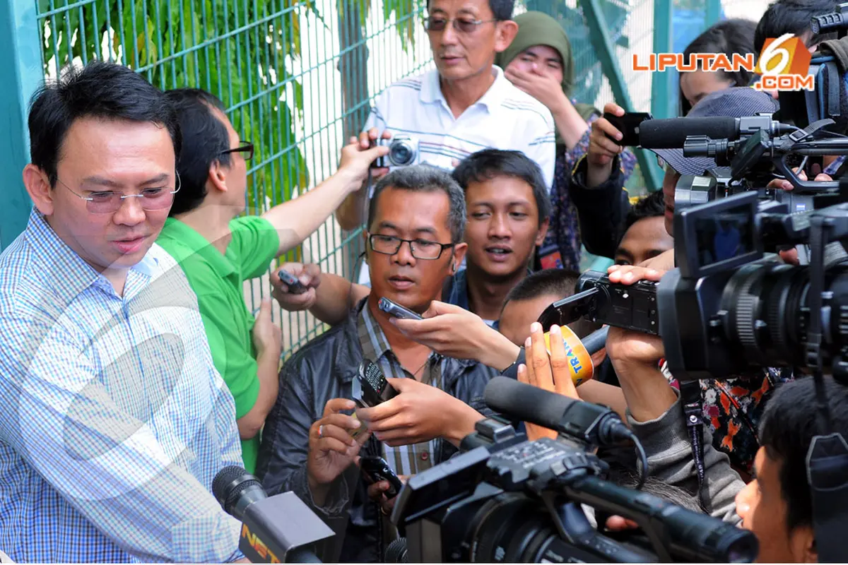 Ahok Ikut Nyoblos Bareng Istri