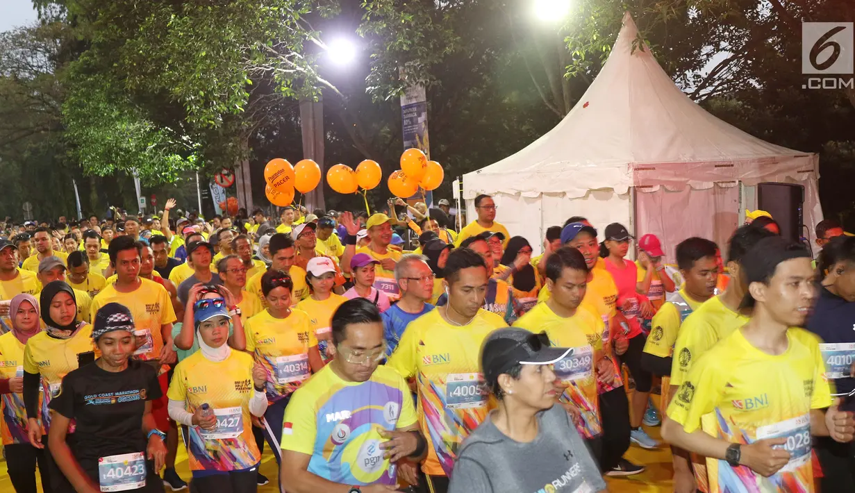 Peserta mengikuti acara BNI-UI Half Marathon 2019 di Kampus Universitas Indonesia, Depok, Jawa Barat, Minggu (7/7/2019). BNI UI Half Marathon 2019 yang diikuti 4800 peserta dengan kategori 5K, 10K, dan 21K (half marathon) diselenggarakan dalam rangka HUT ke-73 BNI. (Liputan6.com/Herman Zakharia)