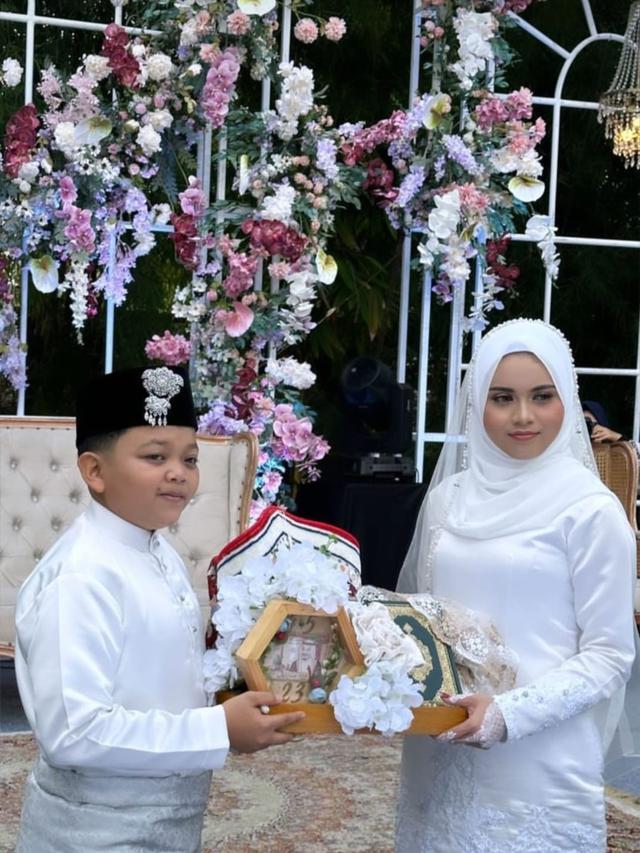 Megi Irawan dan Riva Syahdila