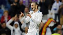 Striker Real Madrid, Gareth Bale, melakukan selebrasi usai mencetak gol ke gawang Celta Vigo pada laga La Liga di Stadion Santiago Bernabeu, Sabtu (12/5/2018). Real Madrid menang 6-0 atas Celta Vigo. (AP/Paul White)