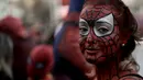 Seorang influencer asal Argentina, Uki Deane, mengorganisir acara ini melalui Instagram, dengan tujuan untuk mengalahkan acara yang diadakan pada bulan Juni di Malaysia yang diikuti oleh 685 orang berkostum Spider-Man. (AP Photo/Rodrigo Abd)