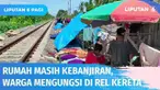 Rumah masih kebanjiran, ratusan warga korban banjir Serang terpaksa mengungsi di jalur rel kereta api. Ketika ada kereta api melintas, mereka lari berhamburan menepi di pinggir rel.