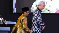 Calon Presiden Ganjar Pranowo bersama Calon Wakil Presiden Mahfud MD di sela acara dialog terbuka bersama Muhammadiyah di Kampus Universitas Muhammadiyah Jakarta (UMJ) Ciputat, Tangerang Selatan, Banten, Kamis (23/11/2023). (Liputan6.com/Herman Zakharia)