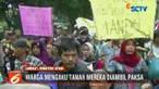 Aksi saling dorong antara petani dengan petugas Satpol PP ini terjadi setelah warga memaksa masuk kantor Bupati Langkat.