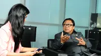 Wakil Ketua MPR RI Oesman Sapta Odang saat wawancara khusus di kantor Liputan6.com, Jakarta, Senin (15/12/2014). (Liputan6.com/Andrian M Tunay)