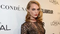 Model Cara Delevingne berpose saat menghadiri Glamour Women Of The Year 2016 di NeueHouse Hollywood, Los Angeles, California, AS (14/11).Cara tampil cantik dengan gaun menerawang berwarna hitam. (Kevork Djansezian/Getty Images/AFP)