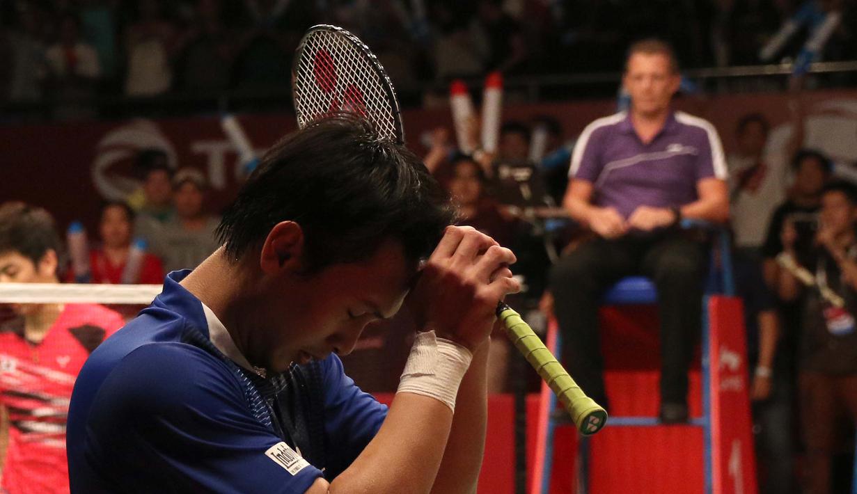 Ekspresi Mohammad Ahsan setelah memastikan kemenangan atas ganda Korea Selatan. (Bola.com/Arief Bagus)