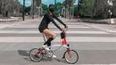 <p>Kirana Larasati menikmati waktunya dengan bersepeda. Di sini, ia memperlihatkan dirinya sedang bersepeda dengan outfit kaus lengan panjang dan mini pants berwarna hitam, kaus kaki panjang hitam, dan sepatu putih. Ia melengkapi penampilannya dengan masker dan topi. Foto: Instagram.</p>