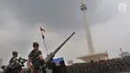 Pasukan Gabungan TNI-Polri mengikuti Apel Kesiapan Natal, Tahun Baru 2019 serta menjelang Pemilu legislasi dan Presiden 2019 di Monas, Jakarta, Jumat (30/11). Apel  diikuti 50.000 personel dari AD, AL, AU dan Polri. (Liputan6.com/Johan Tallo)