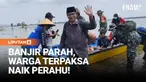 Aktivitas warga Desa Karangrowo, Kecamatan Jakenan, Kabupaten Pati, Jawa Tengah, terganggu akibat banjir yang merendam seluruh akses jalan menuju desa. Genangan air yang meluas membuat wilayah tersebut tampak seperti lautan.