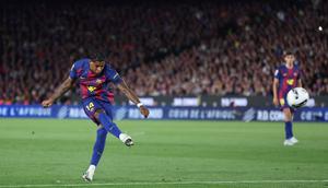 Penyerang Inggris Barcelona #14 Marcus Rashford mencetak gol pertama timnya selama pertandingan Liga Spanyol antara FC Barcelona dan Real Madrid CF di Stadion Camp Nou di Barcelona pada 11 Mei 2026. (Josep LAGO/AFP)