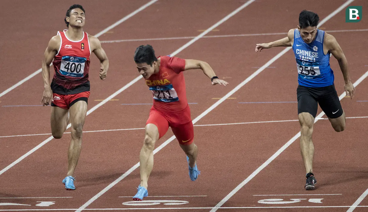 Pelari Indonesia, Lalu Muhammad Zohri, saat berlaga pada nomor 100 meter Asian Games di SUGBK, Jakarta, Minggu (26/8/2018). Lalu Zohri finish di urutan ke tujuh dengan catatan waktu 10,20 detik. (Bola.com/Vitalis Yogi Trisna)