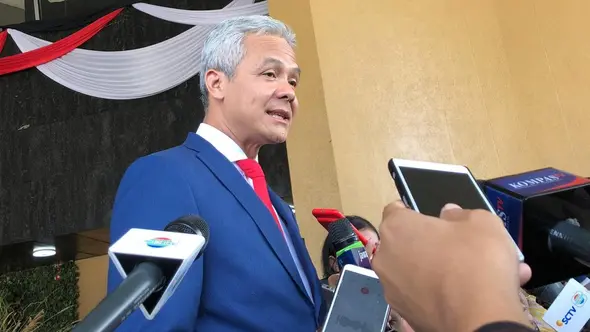 Gubernur Jawa Tengah Ganjar Pranowo tiba di Gedung MPR jelang pelantikan Presiden. (Liputan6.com/Delvira Hutabarat)