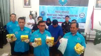 Barang bukti berupa sabu seberat 20 Kg dan puluhan ribu butir pil ekstasi diamankan BNN Sumsel (Liputan6.com / Nefri Inge)