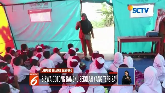 Memulai hari pertama sekolah, ratusan pelajar SD korban tsunami di Kecamatan Rajabasa, Lampung Selatan, harus belajar di tenda darurat.