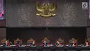 Ketua Majelis Hakim Mahkamah Konstitusi, Anwar Usman didampingi sejumlah Hakim Konstitusi memimpin sidang perdana sengketa Pilpres 2019 di Mahkamah Konstitusi (MK), Jakarta, Jumat (14/6/2019). Sidang itu memiliki agenda pembacaan materi gugatan dari pemohon. (Lputan6.com/Johan Tallo)