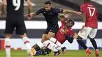 Gelandang Manchester United, Paul Pogba (kanan) berusaha menghadang gelandang Granada Yangel Herrera dalam leg kedua perempat final Liga Europa di Stadion Old Trafford, Jumat dinihari WIB (16/4/2021). MU menunjukkan dominasinya atas Granada usai mencatat kemenangan 2-0. (AP Photo/Dave Thompson)
