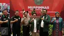 Ketua Umum DPP PKB Muhaimin Iskandar (ketiga kanan) dan Kapolri Jenderal Pol Tito Karnavian (ketiga kiri) berfoto bersama usai menghadiri Muspimnas Dewan Koordinasi Nasional (DKN) Garda Bangsa di Jakarta, Kamis (19/1). (Liputan6.com/Johan Tallo)