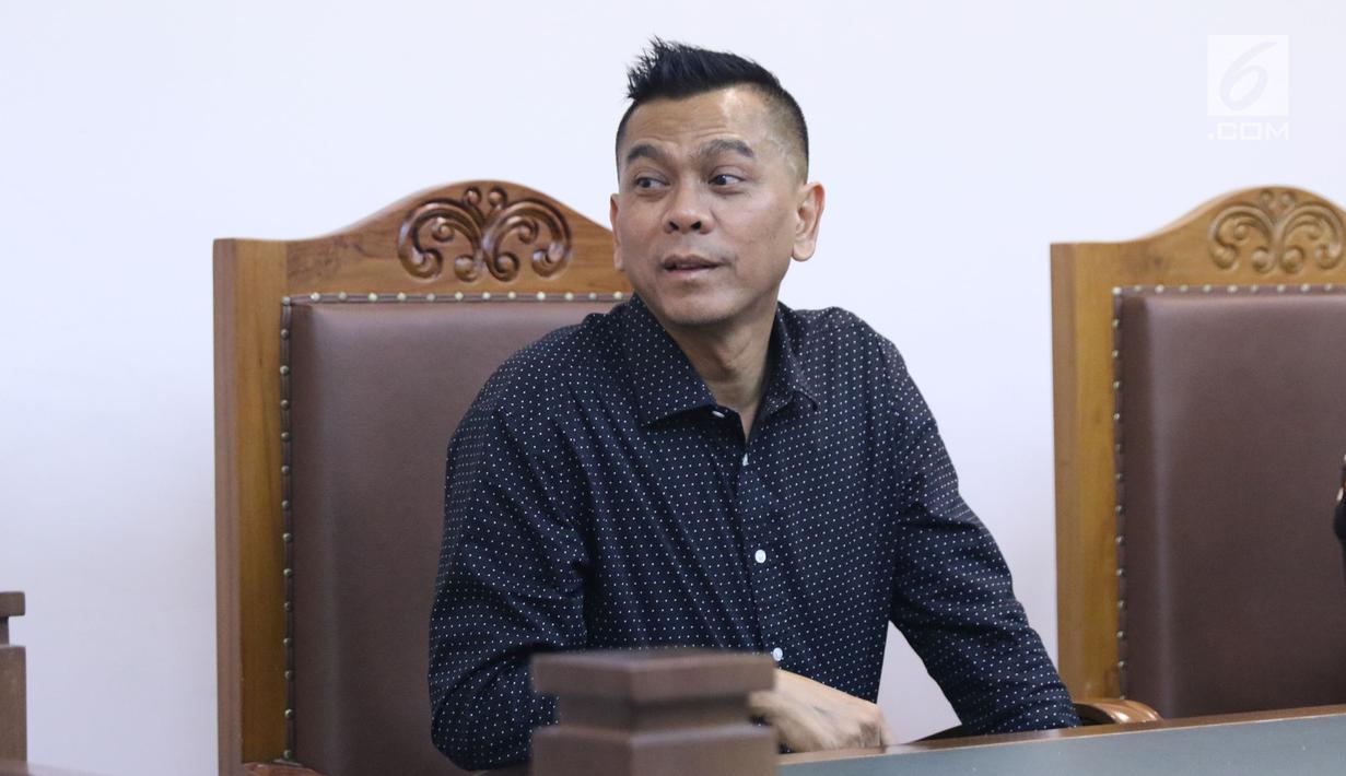 Mantan anggota DPRD DKI Jakarta, Mohamad Sanusi saat menjalani sidang lanjutan Peninjauan Kembali (PK) di PN Jakarta Pusat, Rabu (25/7/2018). M Sanusi merupakan terpidana suap pembahasan Raperda tentang Reklamasi. (Liputan6.com/Helmi Fithriansyah)