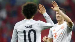 Robert Lewandowski menjadi bintang kemenangan Bayern Munchen dengan memborong dua gol. (AP Photo/Hussein Sayed)