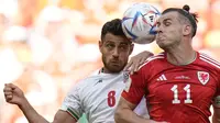 Pertandingan yang digelar di Ahmed bin Ali Stadium ini berjalan dengan sengit. Sejak menit awal pertandingan, baik Iran dan juga Wales sama-sama tampil all-out dalam menyerang, namun kesulitan untuk membuat peluang matang. (AP Photo/Francisco Seco)