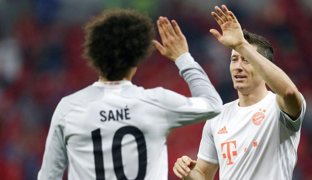 Robert Lewandowski menjadi bintang kemenangan Bayern Munchen dengan memborong dua gol. (AP Photo/Hussein Sayed)