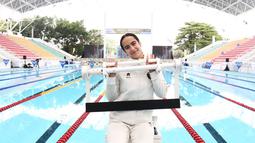 Jauh dari sorotan karier gemilangnya, Masniari memiliki tekad tinggi sejak kecil. Perenang berdarah Batak-Jerman ini memulai renang di usia 11 tahun di Wiesbaden, Jerman. Ia kemudian melanjutkan latihan hingga Frankfurt untuk mengasah kemampuan. (Dok. PB Akuatik Indonesia)