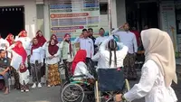 Dari Kursi Roda, Pengibar Bendera Kibarkan Merah Putih di Kudus