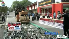 Polresta Barelang, Batam, musnahkan 9 ribu miras, 574 gram sabu, dan 1.000 gram ganja dengan alat berat.