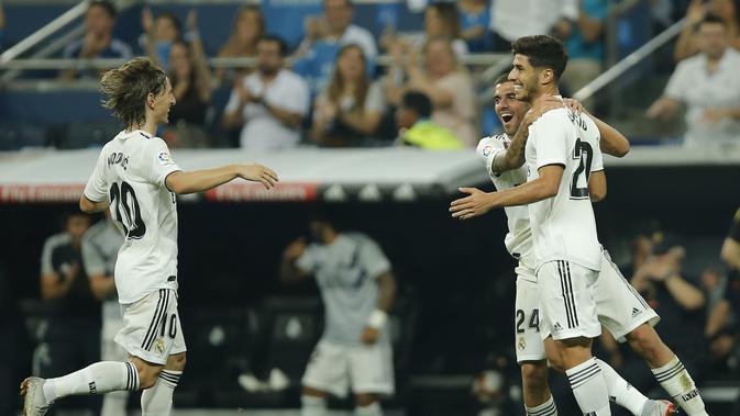 Real Madrid mengalahkan Espanyol berkat gol tunggal Marco Asensio.  (AP Photo/Paul White)