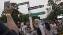 Pengunjung beserta keluarga berfoto di area Festival Asian Games 2018 pada hari Sabtu (1/9/2018) di kawasan Gelora Bung Karno, Senayan Jakarta. (Bola.com/Peksi Cahyo)