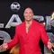 Aktor AS Dwayne Johnson tiba untuk pemutaran perdana film 'Black Adam' di Time Square, New York City, Amerika Serikat, 12 Oktober 2022. Melengkapi penampilannya, Dwayne Johnson menggunakan sepasang sepatu kulit hitam. (Jamie McCarthy/Getty Images/AFP)