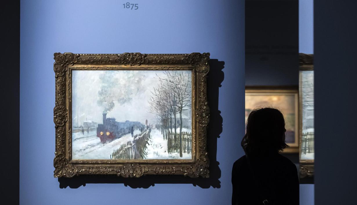 Lukisan karya Claude Monet yang berjudul 'Train in the Snow or The Locomotive' ditampilkan dalam pameran 'Monet. Capolavori dal Musee Marmottan' di Roma, Italia (18/10). (Angelo Carconi / ANSA via AP)