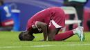 Pemain Qatar, Almoez Ali, melakukan selebrasi setelah mencetak gol ke gawang Lebanon pada babak penyisihan Grup A Piala Asia 2023 di Stadion Lusail, Jumat (12/1/2024). Qatar menang tiga gol tanpa balas. (AP Photo/Aijaz Rahi)