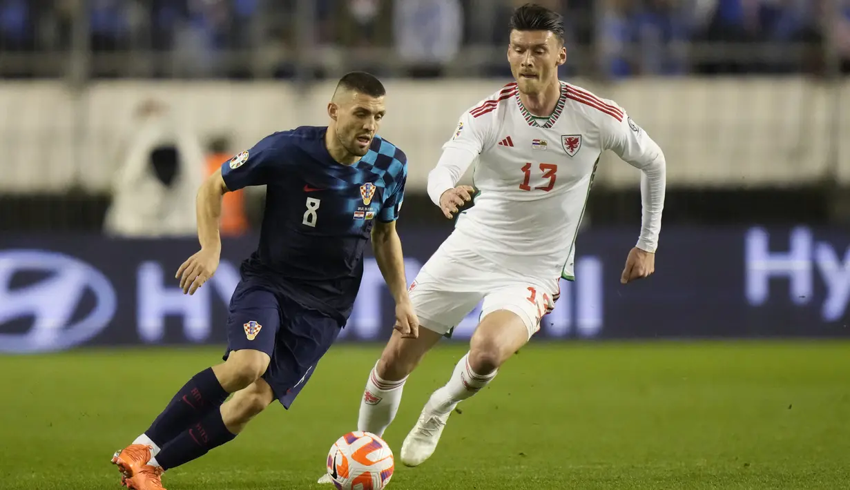 Luka Modric dkk gagal mengamankan lemparan ke dalam Connor Roberts dan Broadhead, yang masuk sebagai pemain pengganti, sukses menjebol gawang Kroasia di injury time babak kedua. (AP Photo/Darko Bandic)