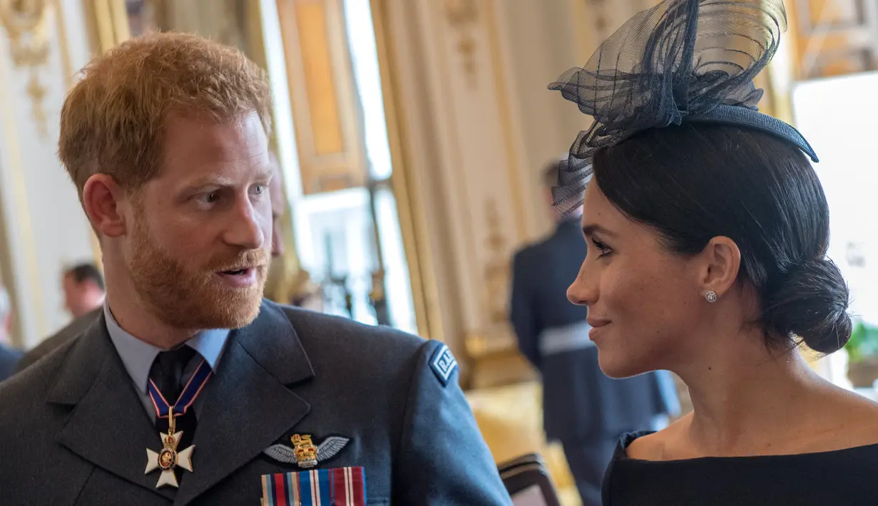 Pangeran Harry benar-benar mencintai Meghan Markle. Meski ia ingin miliki anak, namun Pangeran Harry tak ingin terburu-buru. (CHRIS J RATCLIFFE / POOL / AFP)