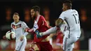 Penyerang Georgia, Levan Mchedlidze (kiri) erusaha merebut bola  dari kejaran Bek Jerman, Jerome Boateng saat kualifikasi Piala Eropa 2016 di Locomotiv Stadium, Minggu (29/3/2015). Jerman menang 2-0 atas Georgia. (AFP PHOTO/Patrik Stollarz)