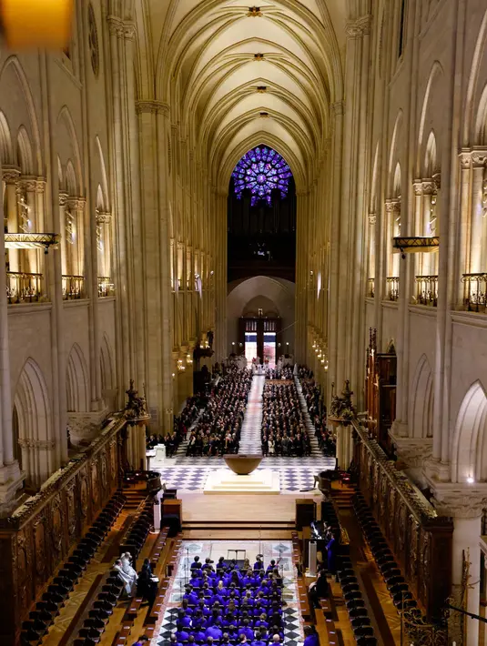 Kegiatan ini sekaligus menjadi simbol kebangkitan katedral Notre-Dame dan pengingat atas semangat bangsa Prancis. (Ludovic MARIN/POOL/AFP)