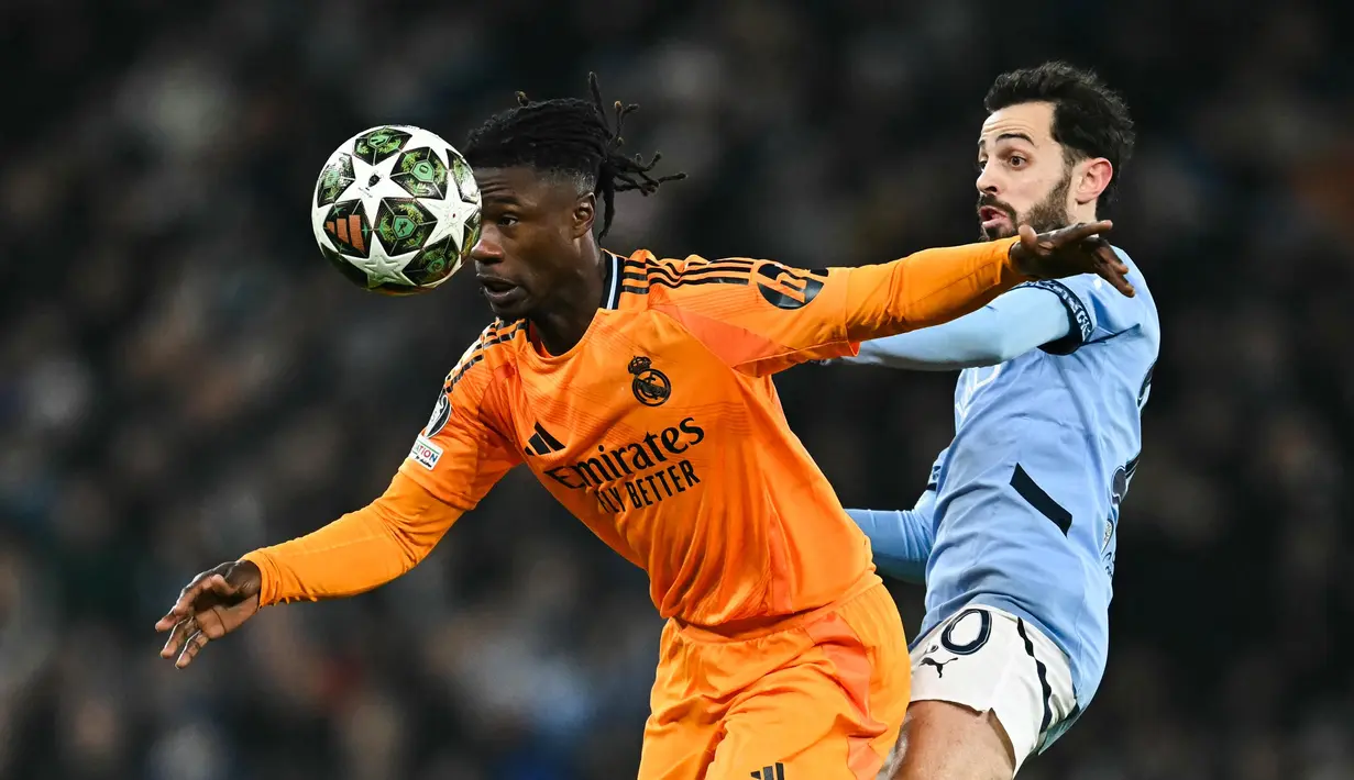Laga berlangsung ketat dan sengit. The Citizens sempat unggul dua kali, namun Real Madrid berhasil membalikkan keadaan. (Paul ELLIS/AFP)